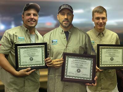 The Pool Table Doctor staff getting their certifications.